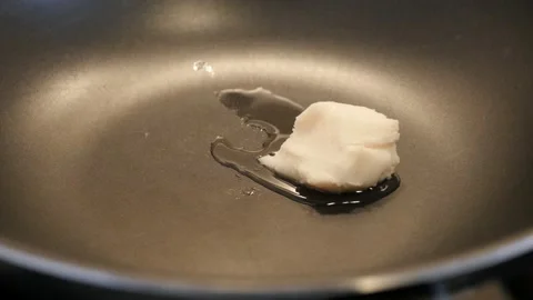 Melting of lard in the wok close-up Stock Footage 88458901