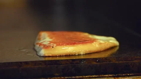 Melting Perfection: Sizzling Slice of Cheese on the Grill for the Ultimate Stock-Footage 288690975