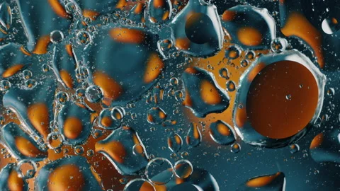 Melting Plastic Bubbles. Iridescent plastic surface melting, warping, and Stock Footage 138460026