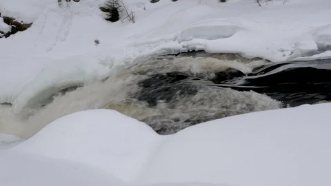 Melting river stream creates foamy rapids close view Video stock 109499476