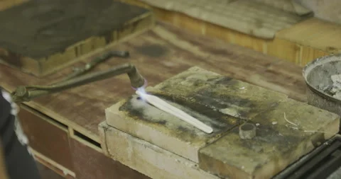 Melting silver with flame Stockbeeldmateriaal 141361591