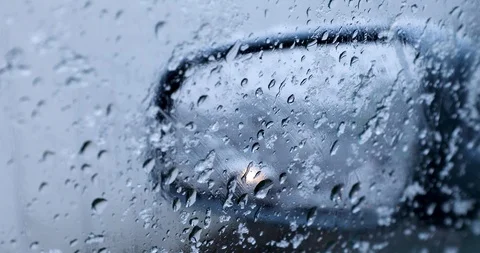 Melting Snow Running Down The side window of the car Stock-Footage 122259336