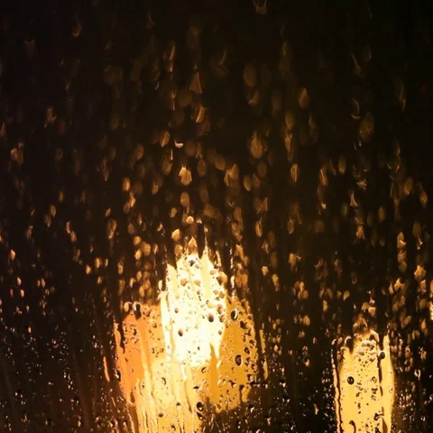 Melting snow runs down the windowpane on the eve of Christmas. Holiday relax. Stock Footage 69424933