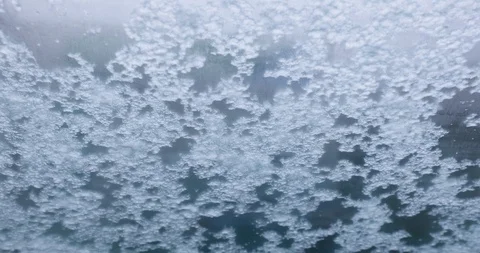 Melting Snow Runs Down The Windshield And Swipes Away With A Car Wiper Stock-Footage 122259359