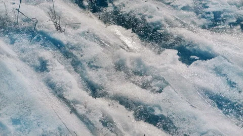 Melting snow in spring an old grass and leafs under it. Stock Footage 103601012