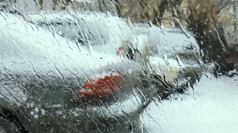 Melting snow on the windshield of the car Stock Footage 84386978