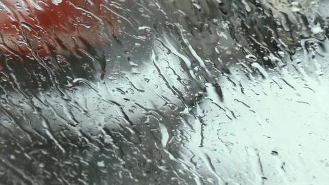 Melting snow on the windshield of the car Stock Footage 84387028