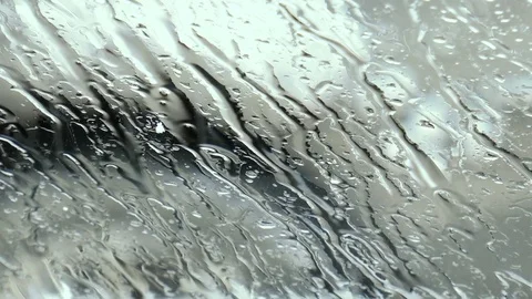 Melting snow on the windshield of the car Stock Footage 84387106