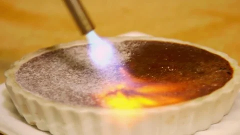 Melting Sugar on Creme Brulee Stock-Footage 75686414