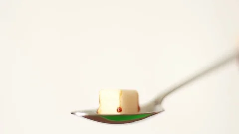 Melting sugar in the teaspoon Stock Footage 77185154