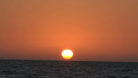 Melting sun on waves of sea Stock Footage 115942153