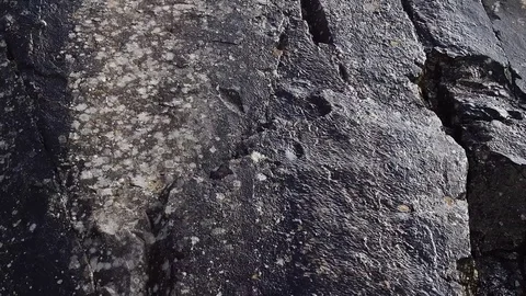 The meltwater flows down the cliff. Stock Footage 73426285