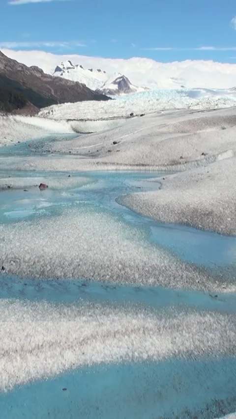 Meltwater river flows through glacier in Patagonia, Andes, Argentina Stock Footage 313682694