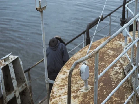 Member of the crew checks condition, old ship Stock Footage 71874789