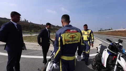 A member of Indian Army breaks record for longest reverse drive on a motorcycle  Stock Footage 295154371