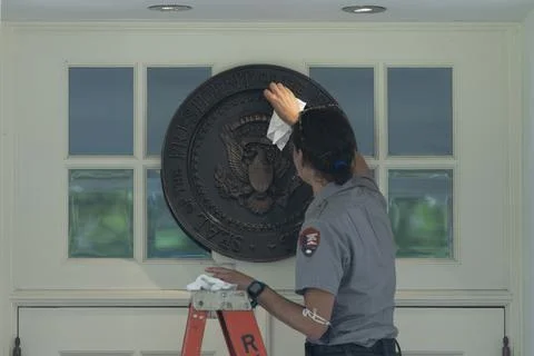 A member of the National Park Service cleans the Presidential Seal, Washington,  Stock Photos