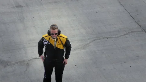 A member of a racing team during a break. 스톡 동영상 58457076