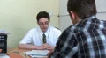 A member of staff talking to a client HD Footage