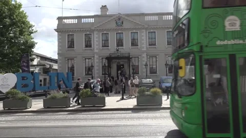 Members of the public queue up to sign the book of condolence for Glen Hansard Stock Footage 340896527