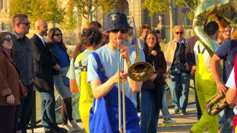 Members of a student marching band playing brass instruments and horns Stock-Footage 337420063