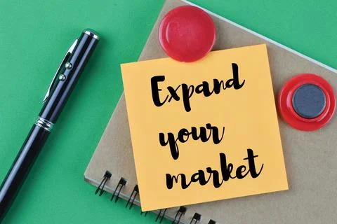 Memo note written with EXPAND YOUR MARKET 写真素材