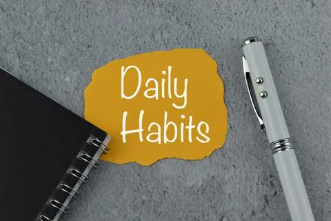 Memo note written with text DAILY HABITS. Stock Photos