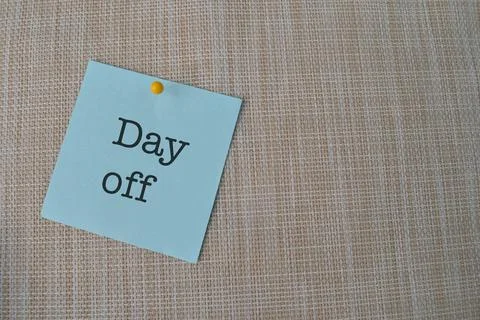 Memo note written with text DAY OFF isolated on brown background Stock Photos