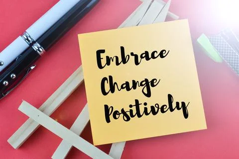 Memo note written with text EMBRACE CHANGE POSITIVELY. Stock Photos