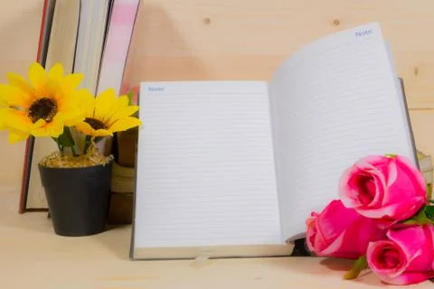 Memo notes beautiful with flowers on a wooden background. Stock Photos