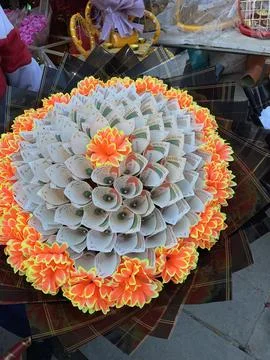 Memorable and creative gift that blends floral artistry with financial good.. Stock Photos
