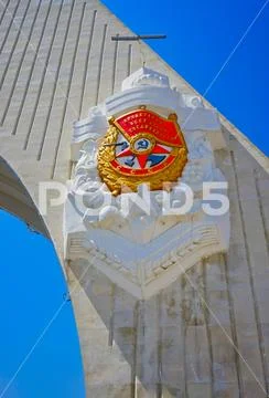 Memorable triumphal arch at the entrance to the city. Stock Photos