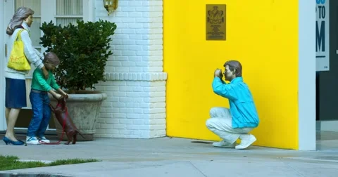 Memorial and statue of the man taking picture of his family in Beverly Hills 4K Stock Footage 67589603