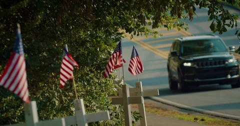 Memorial Day Flags with passing American cars 4K DCI Stock Footage 242553280