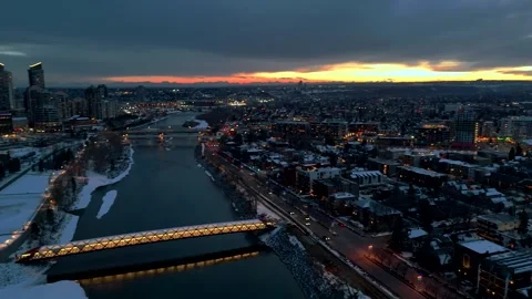 Memorial Drive left pan to Peace Bridge and Bow river. winter evening Stock Footage 334698729
