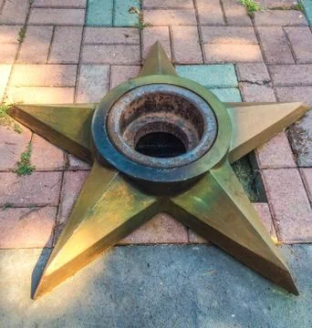 The memorial flame in the shape of a star Stock Photos