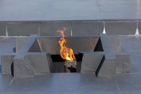 Memorial, memory, eternal flame, remember, believe, conquer, grieve. Stock Photos
