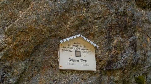 Memorial on rock wall Stock Photos