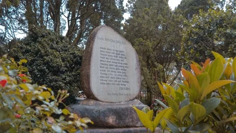 A memorial stone engraved with Vietnamese text – a poetic verses Stock Footage 333355756