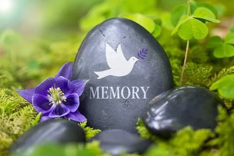 Memory Black stone with the Word ?Memory? and the Dove of Peace Copyright:... Stock-Fotos
