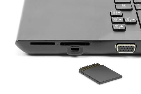 Memory card in front of the laptops card reader Stock Photos
