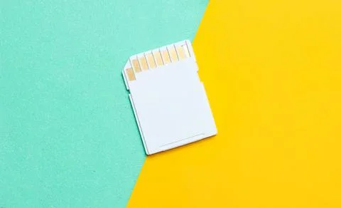 Memory card stack on colorful background with yellow and teal Stock Photos