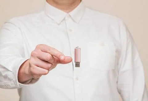 Memory card, usb levitation on the background of human hands Stock Photos