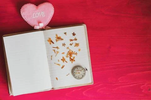 Memory of the heart - old clock dry flowers and children's drawing Stock Photos