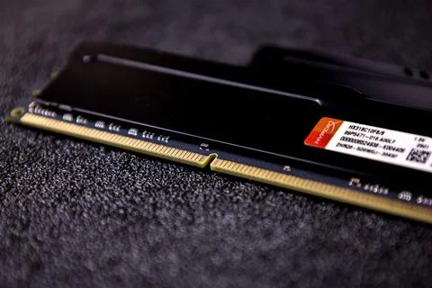 Memory module by Crucial on black background with detailed microchips and Stock Photos