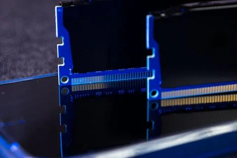 Memory modules placed on a dark surface showing connection points and Stock Photos