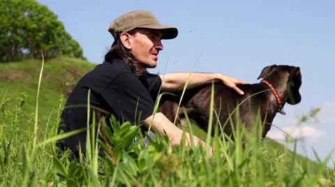 Men and black dog Stock Footage 24707039