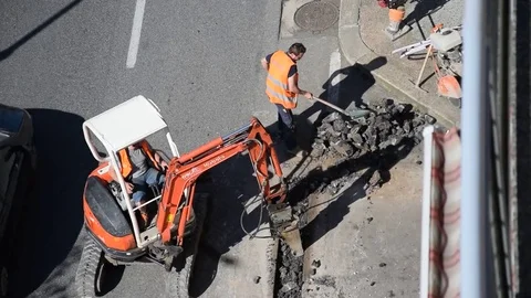 Men and machine at work Stock Footage 73931406