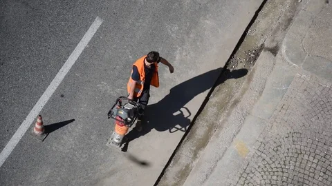 Men and machine at work Stock Footage 73931427