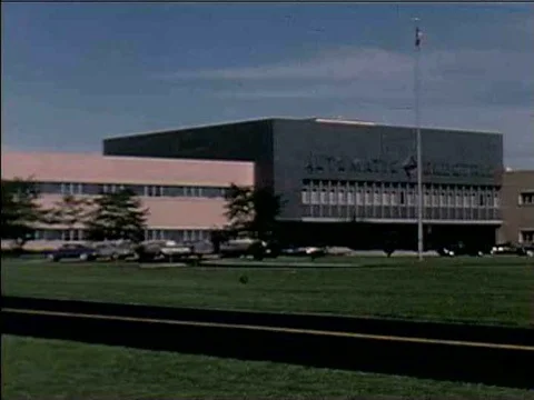 Men and women build the tiny, computerized components necessary for telephonesƒ Stock Footage 75282954