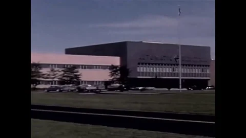 Men and women build the tiny, computerized components necessary for telephones Stock Footage 79521724